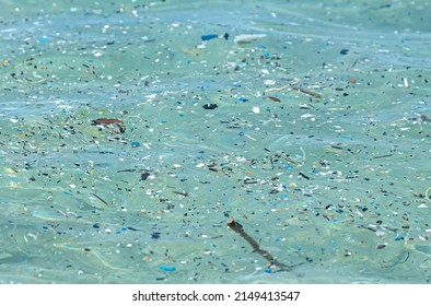 Microplastic Particles Float In The Ocean, Water Pollution.