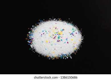 Microplastic Particles In Salt On Black Background. Water Pollution. Microplastic Problem. Threat To Human Health And The Environment. Dangerous Additives. Toxic Substances.