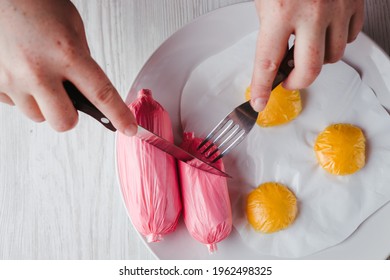 Microplastic In Water And Food. Woman Eating Artificial Food Products Made Of Plastic Bags. Human Health, Nutrition And Environmental Pollution