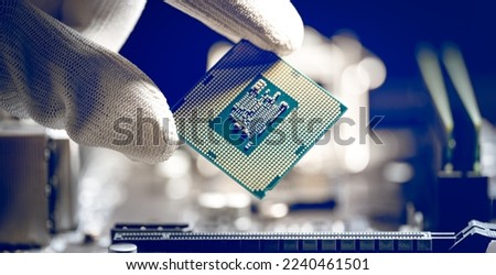 Microprocessor or CPU is held in the hand of a laboratory technician. Central Processing Unit, CPU socket of the computer motherboard, hardware technology, semiconductor chipset, Repairman computer,