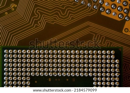 microprocessor on the background of the microcircuit of the motherboard