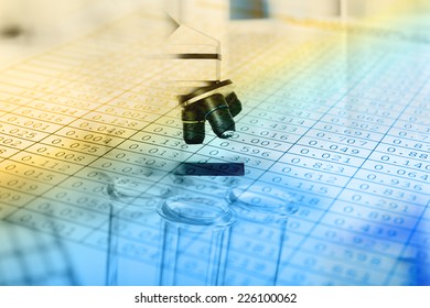 Microscope with biological material and test tubes. Blue tone.