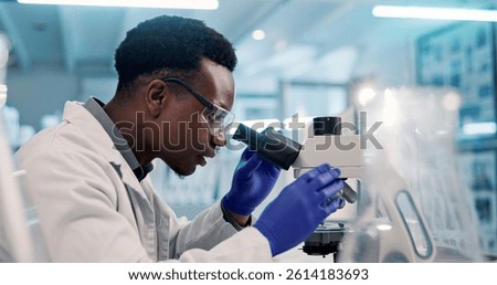 Microscope, black man and scientist in laboratory for medical research, discovery or project on organisms. Biotechnology, goggles and African biologist with equipment for DNA review for innovation.
