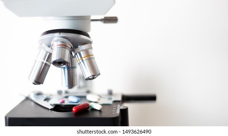 Microscope Close-up With Chemotherapy Antibiotic Pills And Vitamins