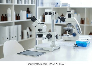 Microscope, empty laboratory and science with DNA for blood test, hair or tissue sample. Forensics, biology and equipment with tablet for genetic identification, analysis or research investigation