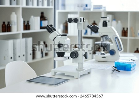 Microscope, empty laboratory and science with DNA for blood test, hair or tissue sample. Forensics, biology and equipment with tablet for genetic identification, analysis or research investigation
