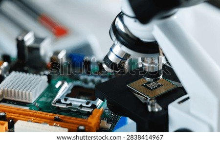 Microscope focusing on microprocessor mounted on motherboard for electronic inspection, fix center service.