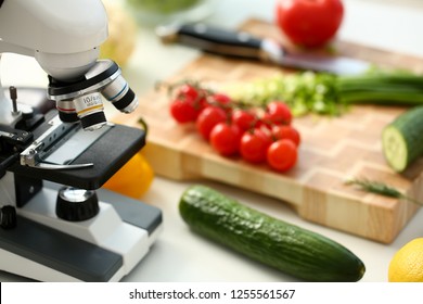 Microscope head on kitchen background vegetables concept nitrates - Powered by Shutterstock