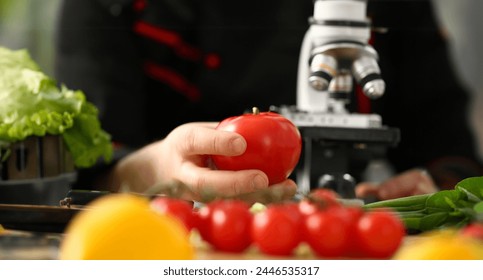 Microscope head on kitchen background vegetables concept nitrates - Powered by Shutterstock