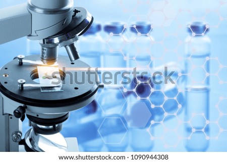 Microscope with lab glassware science laboratory research
