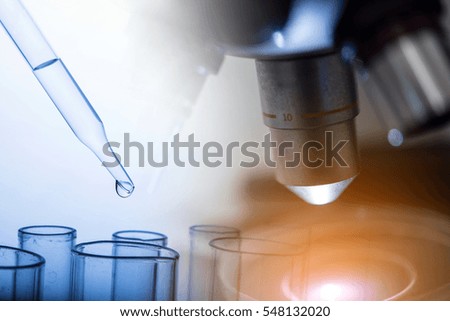 microscope with lab glassware, science laboratory research and development concept
