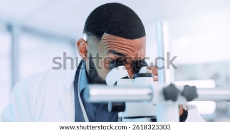 Microscope, man and scientist in laboratory with studying cell function for RNA development. Biotech, medical research and male geneticist with equipment for DNA vaccine, pharmaceutical or immunology