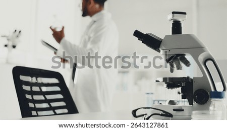 Microscope, man and scientist with tablet in lab for research, medical study and testing sample. Machine, person or biotechnology for experiment, dna production and confidence of vaccine breakthrough
