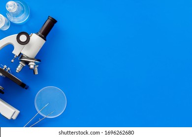 Microscope Medical Reserch. Blood Sample For Analysis. Blue Table Top View Copy Space