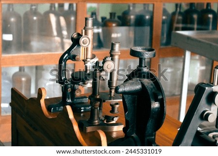 Microscope on table for vintage science background