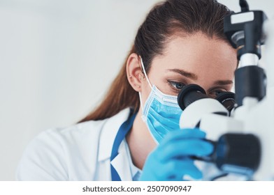 Microscope, scientist and analysis in research laboratory for medicine, biology and pharmaceuticals testing. Female person, doctor and tech with ppe mask for pathology, science and vaccine innovation