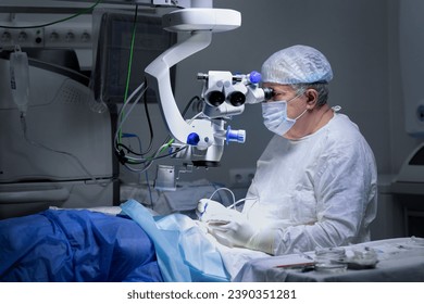 microsurgery of the eye. the surgeon is performing the operation with the help of special equipment