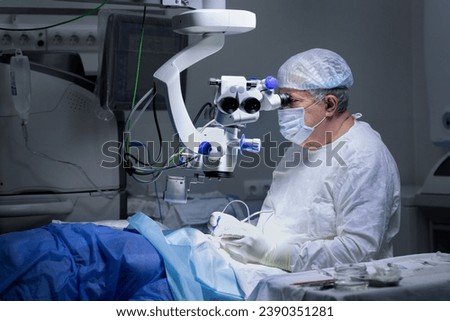microsurgery of the eye. the surgeon is performing the operation with the help of special equipment