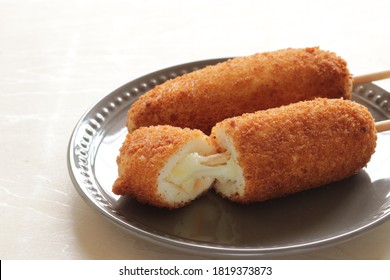 Micro-wave cooked Frozen Korean corn dog for street food on dish