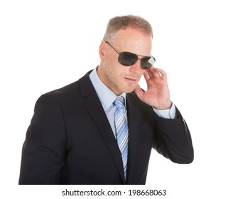 Mid Adult Bodyguard Wearing Sunglasses Isolated Over White Background