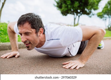 Mid Adult Man Doing Pushups Outdoors