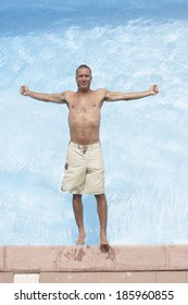 Mid Adult Man Falling Backwards Into Pool (directly Above)