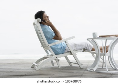 Mid Adult Man On Phone Near Beach