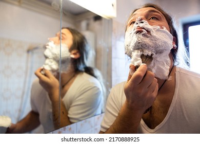 Mid Adult Man Preparing His Beard With Shaving Foam In Domestic Bathroom Close Up