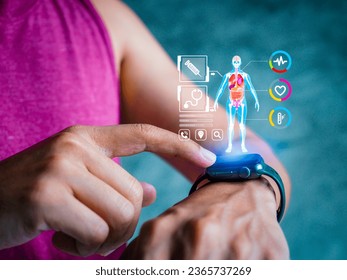 Mid adult man using smart watch during training. Heart monitor beats with wristwatch. smart watch or future data on healthcare. technology in use of smart watch for health condition. - Powered by Shutterstock