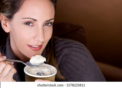 A Mid Adult Woman Eating Ice Cream