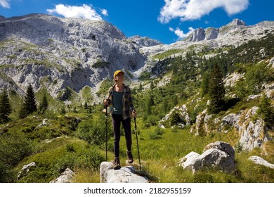 Mid Adult Woman Hiking In Beautiful Summer Alps Mountains