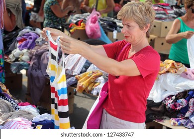 Mid Adult Woman Shopping At Flea Market, Real People No Retouching