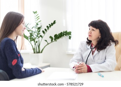 Mid Age Female Doctor With Female Patient.