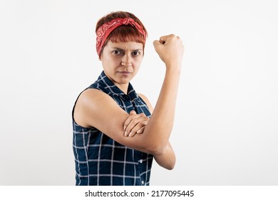 A Mid Age Latin Woman Mimicking The Pose Of Rosie The Riveter