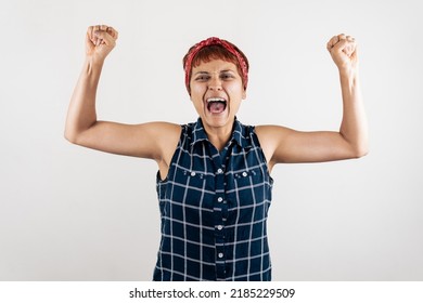 A Mid Age Latin Woman Raising Her Fists In Anger