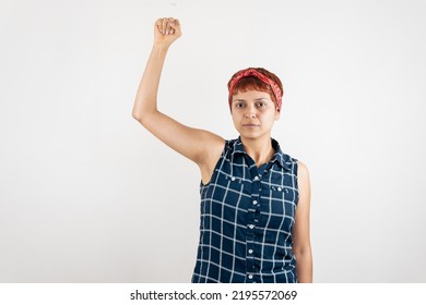 A Mid Age Latin Woman Raising Her Fist