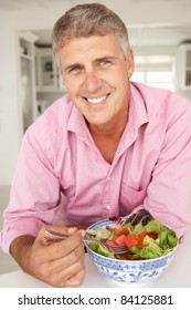 Mid Age Man Eating Salad