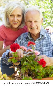 Mid Age Woman And Father In Garden