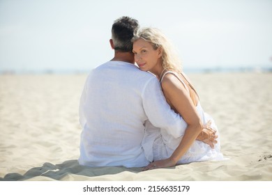 Mid Aged Couple On The Beach