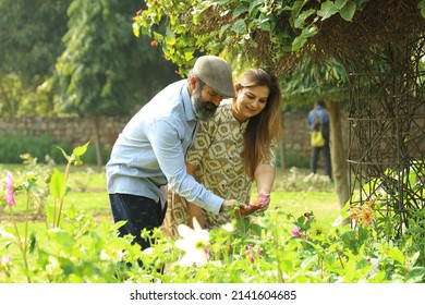 Mid Aged Indian Couple Having A Good Romantic Time In The Green Park.