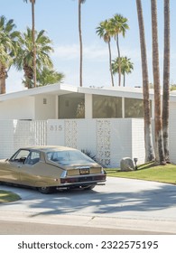 Mid century house and car in driveway in Palm Springs, California