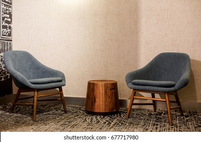 Mid Century Modern Armchairs And End Table In A Contemporary Lounge 