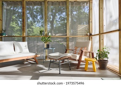 A mid century modern screened in porch - Shutterstock ID 1973575496