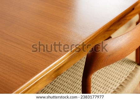 A Mid Century Teak Dining Table with four chairs from the 50s 60s Danish Design Vintage Dining solid wood Modern antique 50s 60s isolated on white wall in modern living room closeup side front view