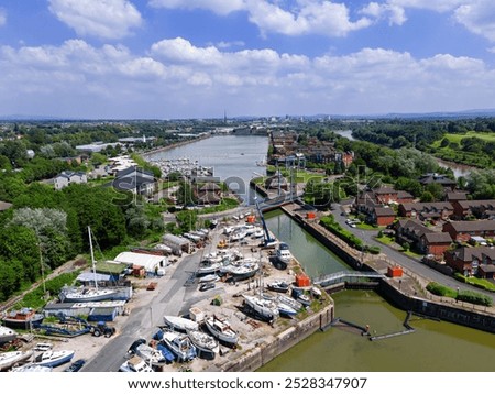 mid level aerial view of the lock gates and inner basin of the re-developed docks area and new marina in Preston, Lancashire, England 