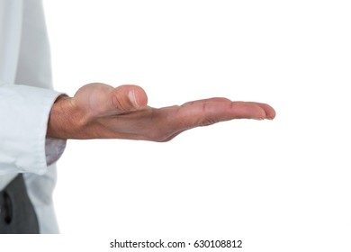 Mid section of executive pretending to be holding invisible object against white background