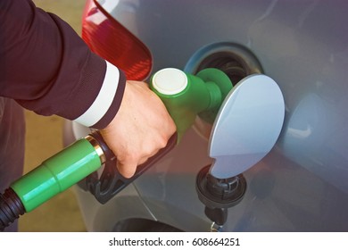 Mid Section Of Person Refueling Car's Tank