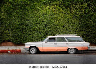 A mid sixties station wagon sits on the street in Hollywood, California.