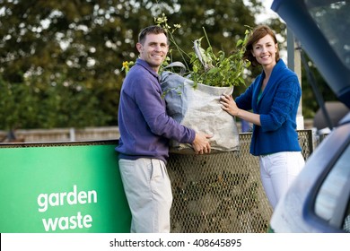 A Mid-adult Couple Recycling Garden Waste