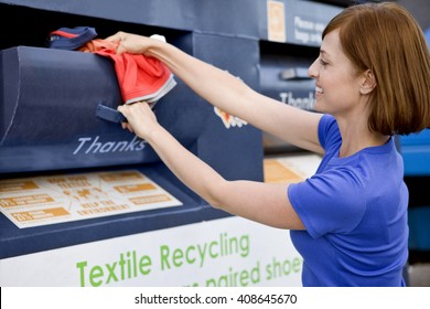 A mid-adult woman recycling clothes